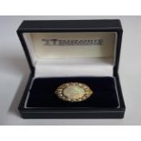 A 9ct Gold Opal & Seed Pearl Dress Ring, the large opal measuring approximately 1cm diameter,