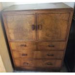 A Vintage Walnut Cupboard Chest, with two doors above two small drawers and two long drawers,