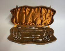 A Silver Mounted Fourteen Piece Manicure Set, Hallmarks for Birmingham, (14), in a fitted case