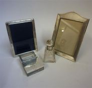 A Small Mixed Lot Of Silver, to include two silver mounted photo frames, a silver lidded desk