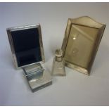 A Small Mixed Lot Of Silver, to include two silver mounted photo frames, a silver lidded desk