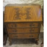 A Mahogany Writing Bureau, with a hinged fall front enclosing fitted drawers and pigeon holes, above