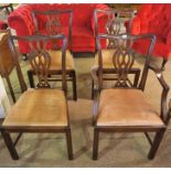 A Set of Seven Mahogany Dining Chairs, in the Georgian style, comprising of one carver and six