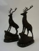 After J Mogniez, A Pair of Cast Bronze Stag Figures, standing on rocks, raised on a veined marble