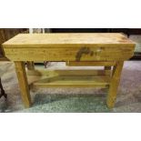 A Pine Work Bench, Raised on square legs, 88cm high, 138cm wide, 56cm deep