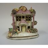 A 19th Century Staffordshire Pottery Pastille Burner, in the form of a house, encrusted with