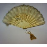 A Japanese Silk Fan, Meiji period, with a feathered fringe top above a painted floral panel, above