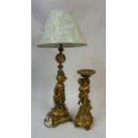 A Gilt Metal & Onyx Table Lamp, Modelled as a nude Putti child, 50cm high, with shade, fitted for