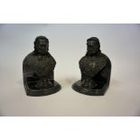 A Pair of Bronze Bookends, in the form of a bronze bust of Queen Victoria, raised on a veined marble