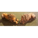 Two Terracotta Recumbent Lion Figures, 30cm long, (2)