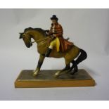 An Austrian Cold Painted Spelter Table Lighter, Modelled as a Highway man on horseback, raised on