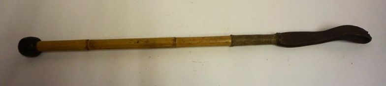 A Riding Crop/Cosh by Swaine & Adeney, circa early 20th century, with a coin style mount to the
