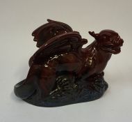 A Royal Doulton Flambe Veined Figure of a Dragon, with two wings, 20cm high, 29cm wide