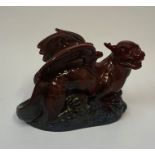 A Royal Doulton Flambe Veined Figure of a Dragon, with two wings, 20cm high, 29cm wide