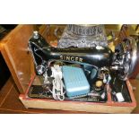 A Vintage Singer Portable Sewing Machine, Number EM 735483, in travel case