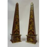 A Pair of Chinoiserie Obelisks, Decorated with gilt panels on a red ground, 55cm high, (2)