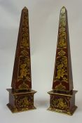 A Pair of Chinoiserie Obelisks, Decorated with gilt panels on a red ground, 55cm high, (2)