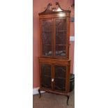 A Sheraton Revival Mahogany Inlaid Corner Cabinet on Base, circa early 20th century, with a swan