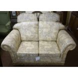 A Modern Three Piece Lounge Suite, Almost new, comprising of a two seater sofa and a pair of