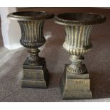 A Pair of Metal Campagna Urns, with moulded reeded decoration, raised on stands, 38cm high, (2)