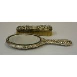 A Silver Backed Hand Mirror, Hallmarks for Birmingham 1904, Decorated with embossed swags and masks,