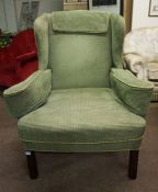 A Pair of Wing Armchairs by David South, Upholstered in green fabric, raised on chamfered legs,