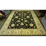 A Large Ziegler Design Machine Made Rug, With all over floral decoration on a black ground with