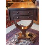 An Early Victorian Mahogany Work Table, With two small drawers and opposing dummy drawers, having