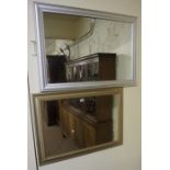 Two Modern Wall Mirrors, one mirror in a silvered frame, 64 x 90cm, 70 x 98cm, (2)