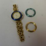 A Genuine Gucci Ladies Wristwatch, on a yellow metal flexible bracelet, with two spare bezels, in