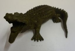 A Painted Metal Figure of a Crocodile, 12 x 25cm