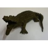 A Painted Metal Figure of a Crocodile, 12 x 25cm