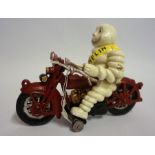 A Painted Metal Figure of the Michelin Man on Motorbike, 17cm high
