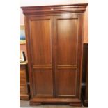 A Willis & Gambier Louis Phillipe Style Cherry Wood Wardrobe, With two doors enclosing a fitted