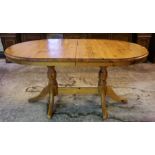 A Modern Pine Extending Kitchen Table, the table pulls out to extend with a spare leaf, 75cm high,