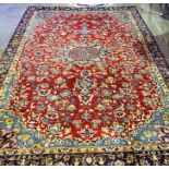 A Large Nayaf Rug, Decorated with a central floral medallion, surrounded by all over floral motifs