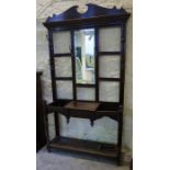 A Large Oak Hall Stand, with a mirrored panel, flanked by metal pegs above single drawer, with