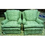 A Pair of Green Damask Easy Armchairs, Decorated with all over floral panels, raised on castors,