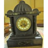 A Victorian Black Slate Mantel Clock, Decorated with marble Corinthian style pillars, with a twin