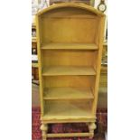 A Light Oak Open Bookcase, With a canopy style top, 130cm high, 59cm wide, 29cm deep