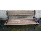 A Garden Bench, with painted metal ends and wooden slats to back rest and seat, 70cm high, 138cm