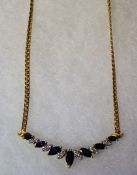 An 18ct Gold Sapphire & Diamond Chain, With seven graduated sapphire stones, approximately 1 carat