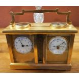 A Gilt Metal Cased Carriage Clock/Barometer, With a compass dial to the top, above a thermometer,