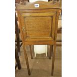 An Edwardian Mahogany Pot Cupboard, With a tray top above a panelled door, 85cm high, 34cm wide