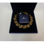 A Swarovski Necklace, Decorated with faux gemstones, with certificate booklet, boxed