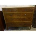 A Mahogany Inlaid Chest of Drawers, With two small drawers above three long drawers, stamped to
