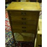 An Edwardian Oak Music Cabinet, With five drawers above undertier, 94cm high, 52cm wide, 35cm deep