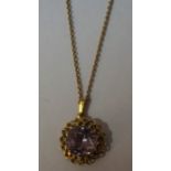 An Unmarked Gold and Amethyst Pendant on Chain, The large amethyst stone is approximately 1cm in