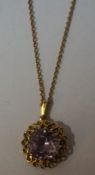 An Unmarked Gold and Amethyst Pendant on Chain, The large amethyst stone is approximately 1cm in