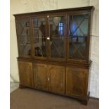 A Reproduction Mahogany Library Bookcase, with four glazed astragal doors enclosing shelves, above